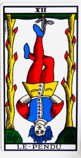 A tarot card representing a man hanged by his left foot. His hair are blue, his face is calm, the situation does not affect him too much